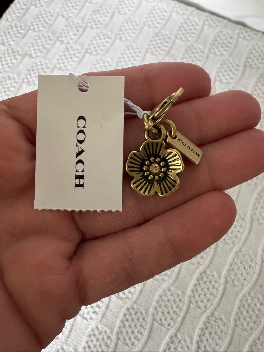 Coach NWT brass tea rose charm